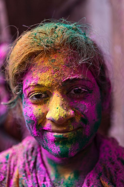 After the ceremony, Apurwahs face is beaming through the pink and yellow and green colors.