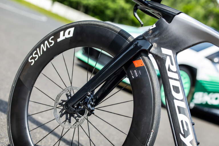 Chasing tenths: on two wheels or four