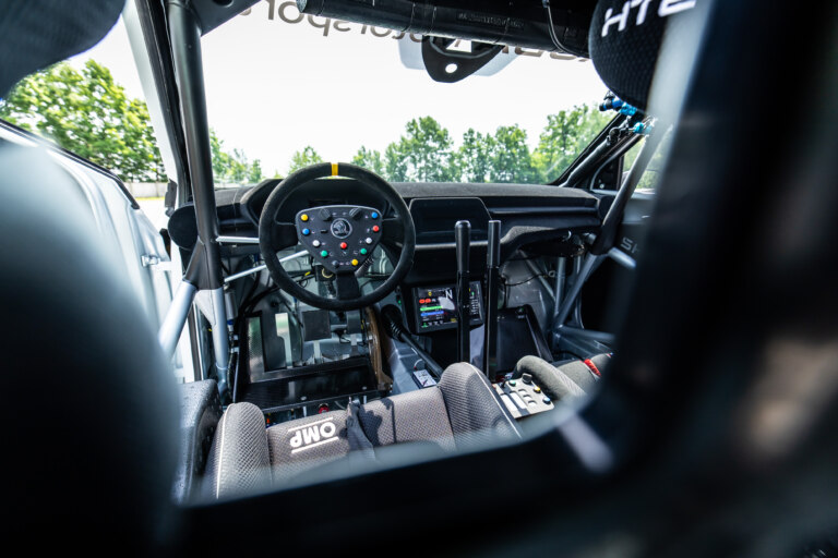 The cockpit of the competition car only remotely resembles a production car.