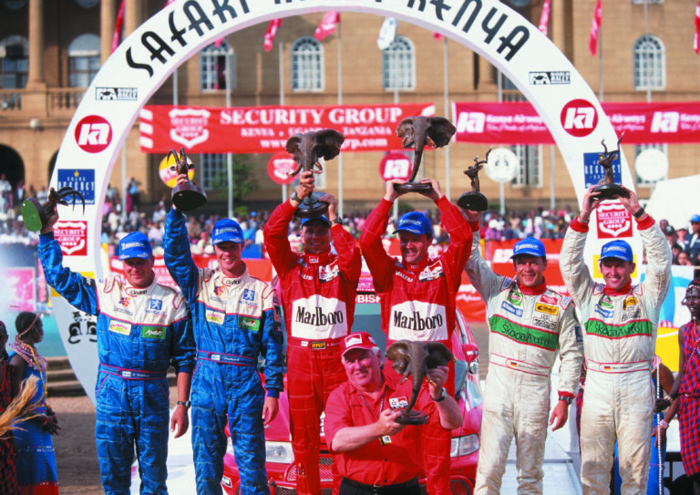 Driver Armin Schwarz and navigator Manfred Hiemer celebrate 3rd place.