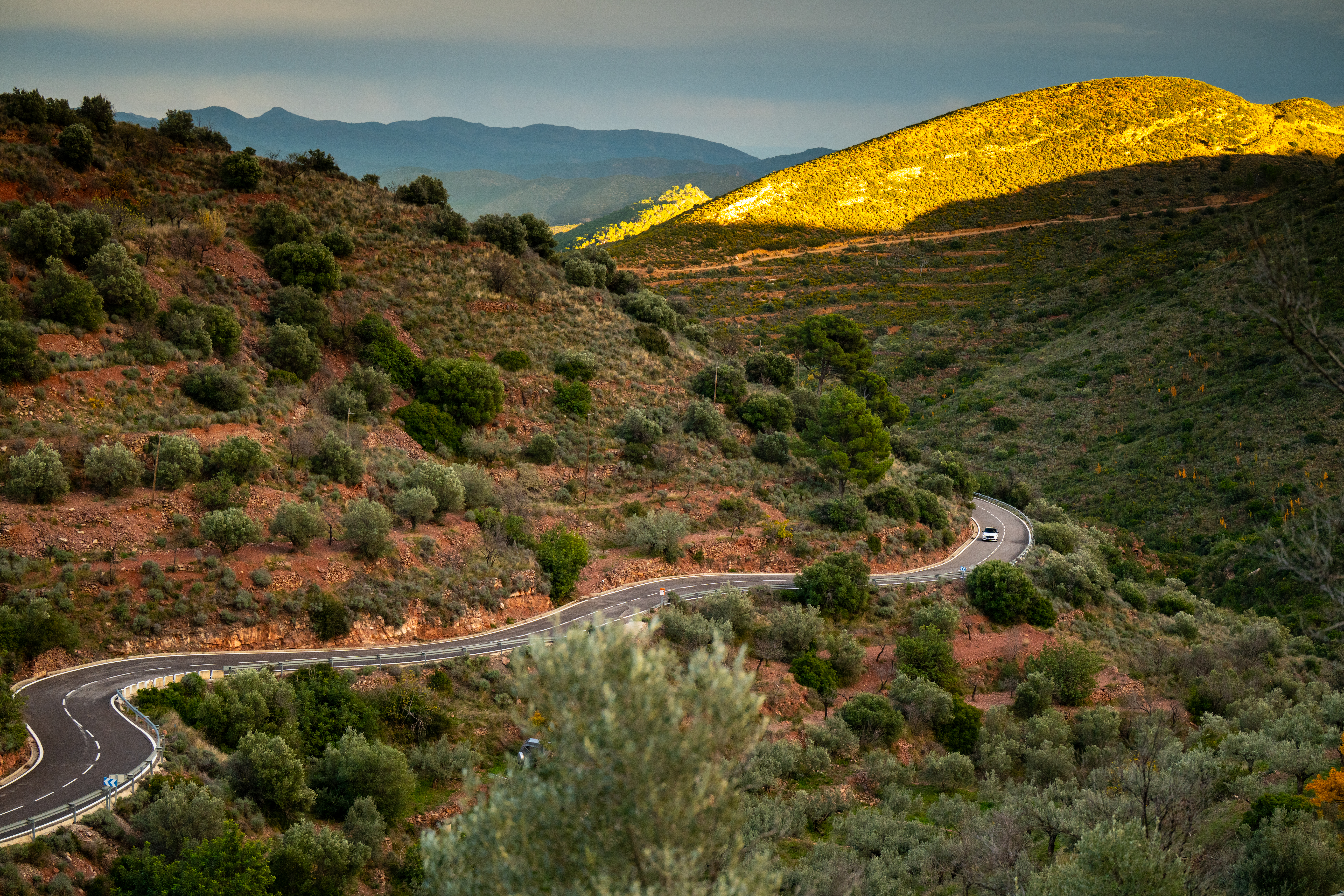 The quiet road winds through the countryside like a serpent.