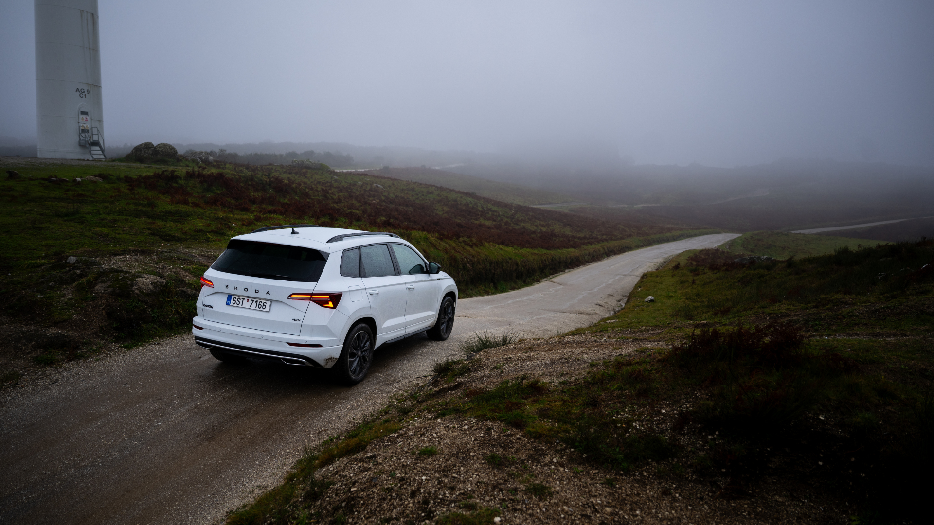 The downward slope of the path below the jump simply increases the distance of the flight